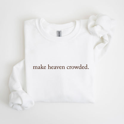 May include: White crew neck sweatshirt with the phrase "make heaven crowded" printed in a dark brown color. The sweatshirt is made of a soft material and has a classic, casual style.