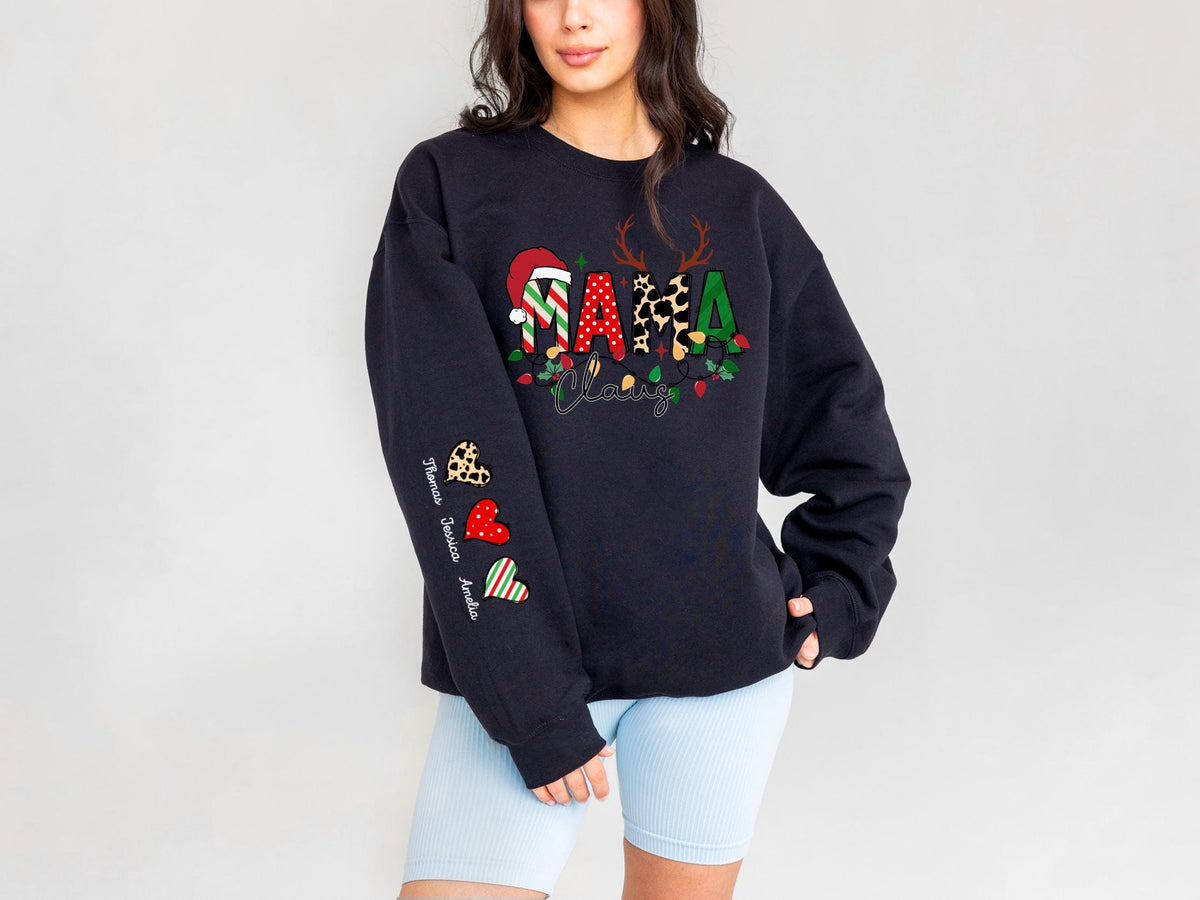 May include: Black sweatshirt with a festive "Mama Claus" design. The design includes a Santa hat, reindeer antlers, and Christmas lights. The sleeve features hearts with names. A cozy and stylish holiday apparel.