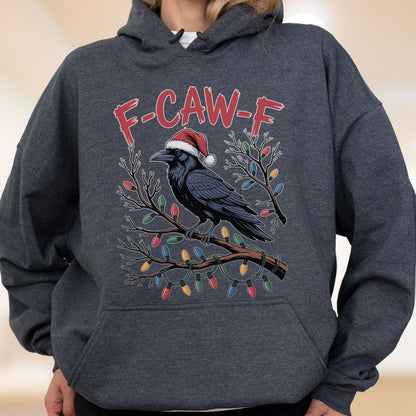 May include: A dark heather gray hooded sweatshirt featuring a graphic of a black crow wearing a red and white Santa hat, perched on a bare tree branch wrapped in colorful Christmas lights, with the red text F-CAW-F printed above the bird.