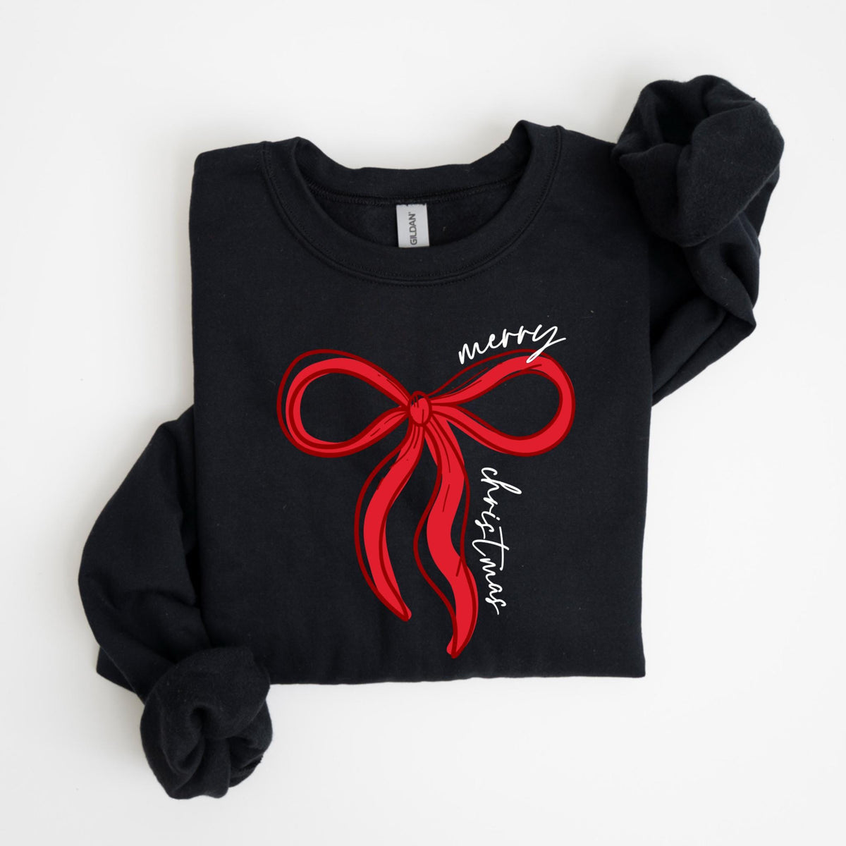 May include: Black sweatshirt with a red bow graphic and the words "merry Christmas" in white script. The long-sleeved top is folded neatly, showcasing the festive design. A cozy and stylish holiday apparel item.