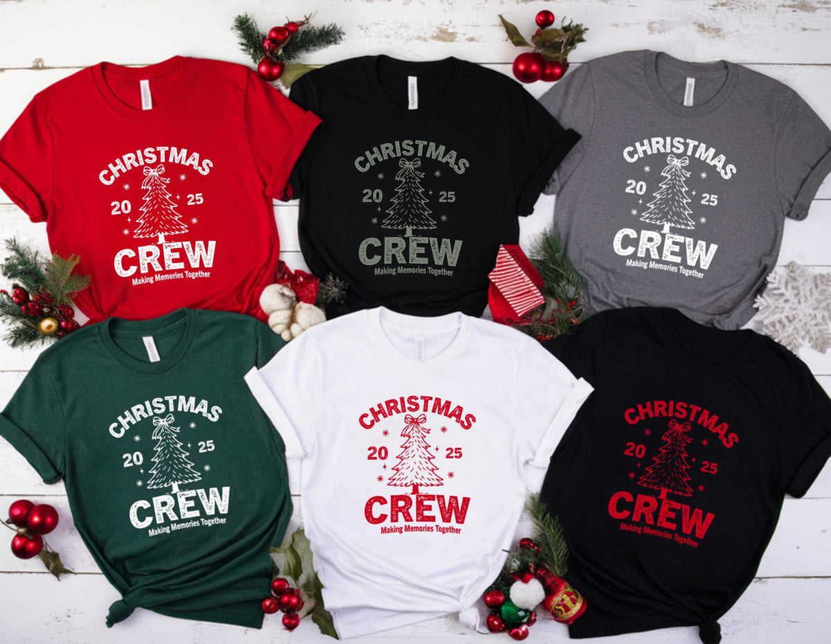 May include: A collection of Christmas Crew t-shirts in various colors, including red, black, white, green, gray, and black. Each shirt features a Christmas tree graphic with the text "CHRISTMAS 20 25 CREW Making Memories Together" in a contrasting color.