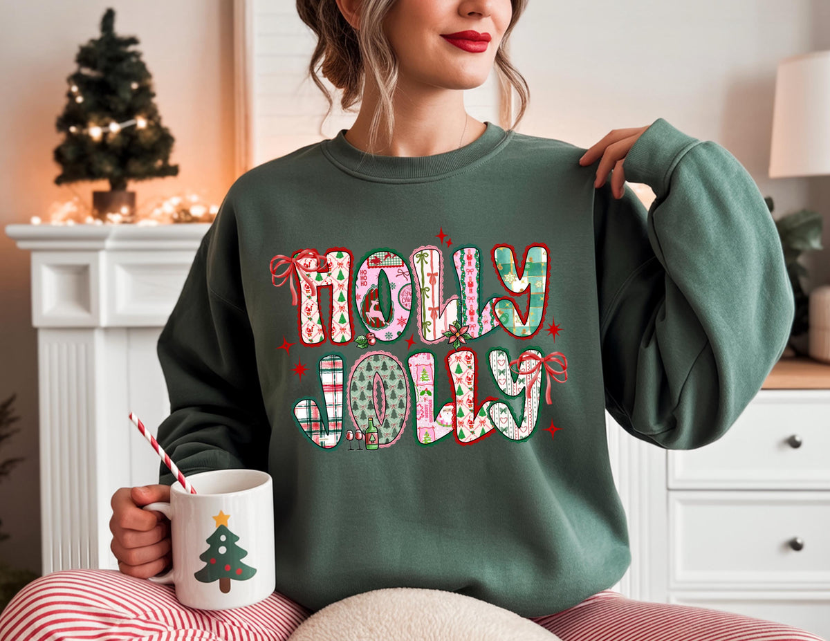 May include: A dark green sweatshirt with the words "HOLLY JOLLY" in a colorful, patterned design. The sweatshirt is paired with red and white striped pajama pants. A white mug with a Christmas tree design is held in the hand.