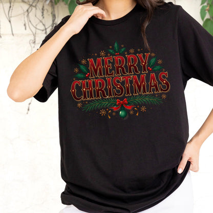 May include: A black short-sleeved t-shirt featuring the text MERRY CHRISTMAS in red and gold lettering. The design includes green holly leaves, red berries, pine branches, a red bow, and a green ornament, accented by small gold star-like shapes.