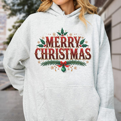 May include: A light gray hoodie featuring a festive "MERRY CHRISTMAS" design in red and brown, adorned with holly leaves, berries, and decorative elements. A red bow and green ornament complete the holiday graphic.