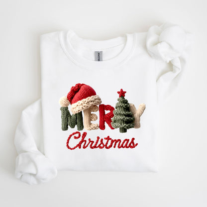 May include: White sweatshirt with a knitted design that spells out "MERRY Christmas". The design includes a Santa hat, Christmas tree, and the word "MERRY" in green, beige, and red. The word "Christmas" is in red.