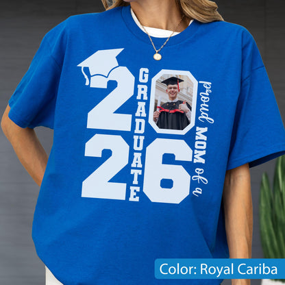 May include: Royal Cariba blue t-shirt with a white graduation cap graphic and the text "2026 Graduate". Includes a photo of a graduate and the text "proud MOM of a".