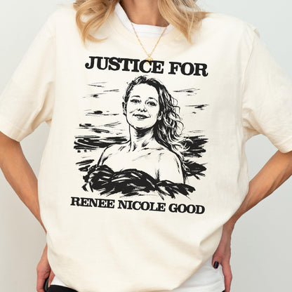 May include: Cream-colored t-shirt with the text "JUSTICE FOR" above a black and white illustration of a woman. Below the illustration, the text reads "RENEE NICOLE GOOD". The shirt has short sleeves.
