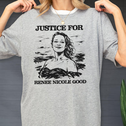 May include: A gray sweatshirt with the words "JUSTICE FOR" above a black and white illustration of a woman. Below the illustration is the text "RENEE NICOLE GOOD". The sweatshirt has a crew neck.
