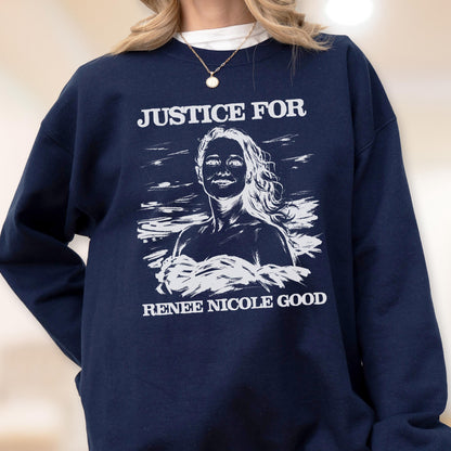 May include: Navy blue sweatshirt with the text "JUSTICE FOR" above a white illustration of a woman's portrait and the text "RENEE NICOLE GOOD" below the portrait. The sweatshirt is a solid color.