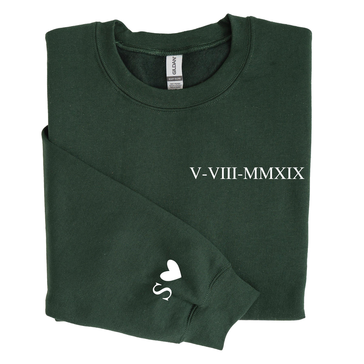 May include: A dark forest green crewneck sweatshirt featuring the white Roman numeral date V-VIII-MMXIX printed on the chest and a white letter S followed by a heart symbol printed on the left sleeve cuff. The garment has a standard ribbed neckline.