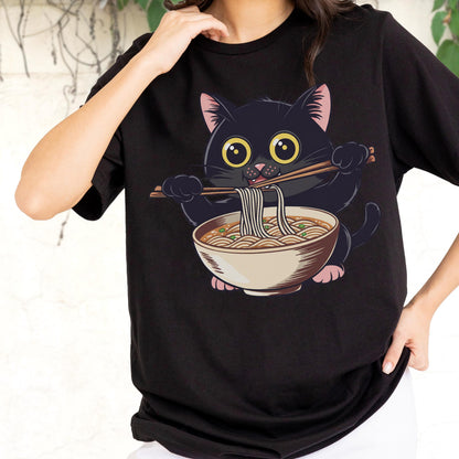 May include: Black t-shirt featuring a cartoon black cat with large yellow eyes, holding chopsticks and eating noodles from a bowl. The cat has pink inner ears and paws. The design is centered on the shirt.