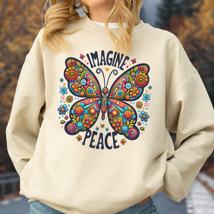 May include: A cream-colored sweatshirt featuring a vibrant butterfly design. The butterfly is adorned with colorful floral patterns and the words "IMAGINE" and "PEACE". The design is surrounded by small flowers.