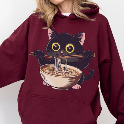May include: Burgundy hoodie featuring a cartoon black cat with large yellow eyes, holding chopsticks and eating noodles from a bowl. The cat is the central focus, with the ramen bowl below. The hoodie is a solid burgundy color.