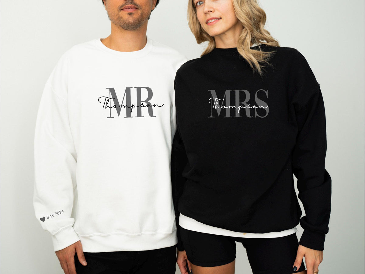 May include: A white sweatshirt with "MR Thompson" printed in gray script and block letters. A black sweatshirt with "MRS Thompson" in gray script and block letters. The date 9.16.2024 is printed on the white sweatshirt's sleeve.