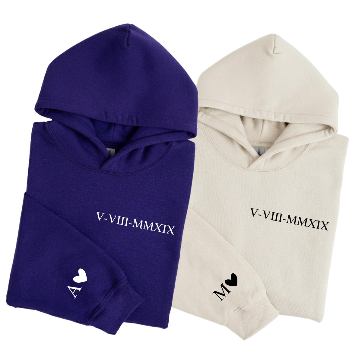 May include: A deep purple hoodie and a cream-colored hoodie, each featuring the Roman numeral date V-VIII-MMXIX printed on the chest. The purple hoodie has a white letter A and a heart on the sleeve, while the cream hoodie has a black M and heart.