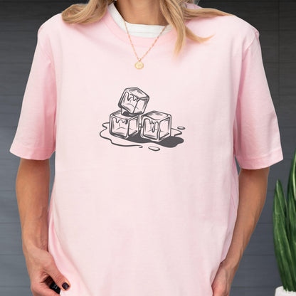 May include: A light pink t-shirt featuring a black and white graphic of three melting ice cubes. The shirt has short sleeves and a crew neck. The design is centered on the front of the shirt.