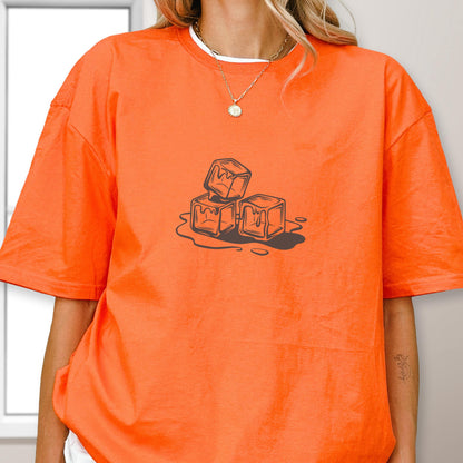 May include: Orange t-shirt with a white crew neck collar. The shirt features a graphic of three melting ice cubes in a brown outline. The ice cubes are dripping onto a puddle.