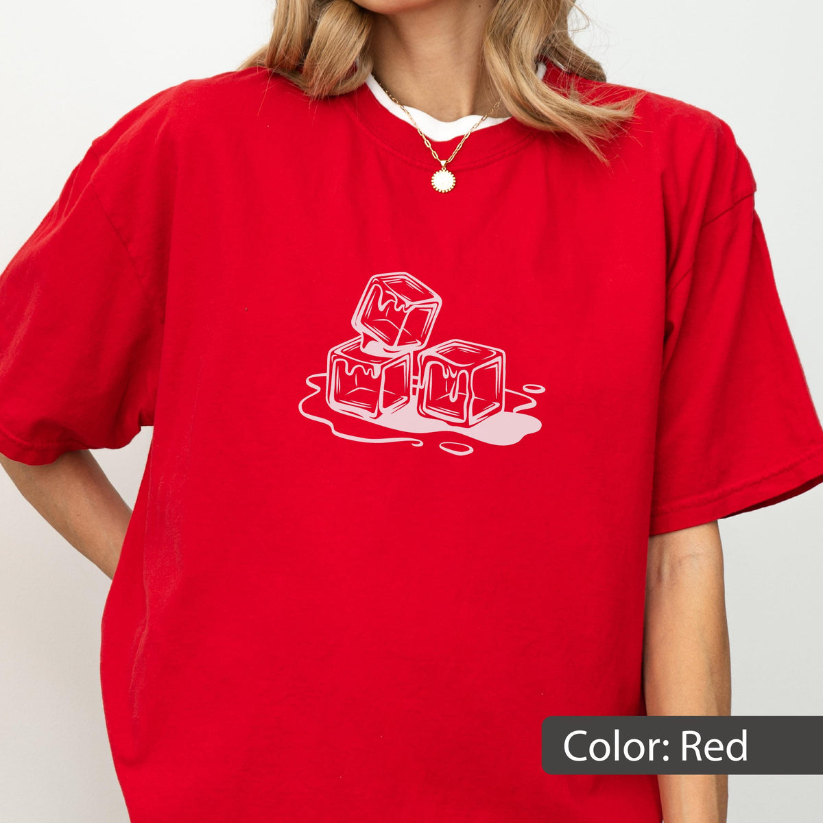 May include: Red t-shirt with a white graphic of three melting ice cubes. The shirt has short sleeves and a crew neck. The text "Color: Red" is at the bottom right of the image.