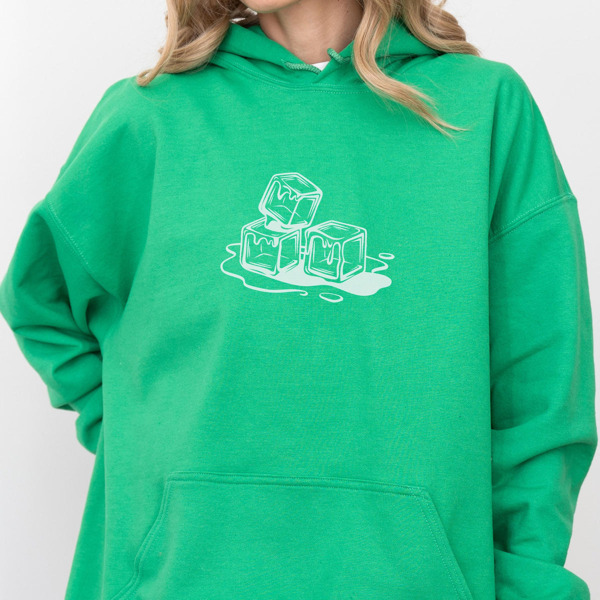 May include: Bright green hoodie with a white graphic of three melting ice cubes. The hoodie has a front pocket and a drawstring hood. The design is centered on the chest.