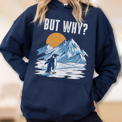May include: Navy blue hoodie with a graphic of a penguin standing on ice in front of mountains and a setting sun. The text "BUT WHY?" is above the graphic in white.