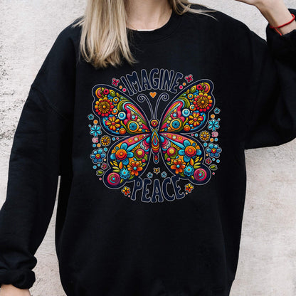May include: Black sweatshirt featuring a colorful butterfly design with the words "IMAGINE PEACE". The butterfly is adorned with flowers in shades of orange, blue, yellow, and pink. The sweatshirt has a crew neck and long sleeves.