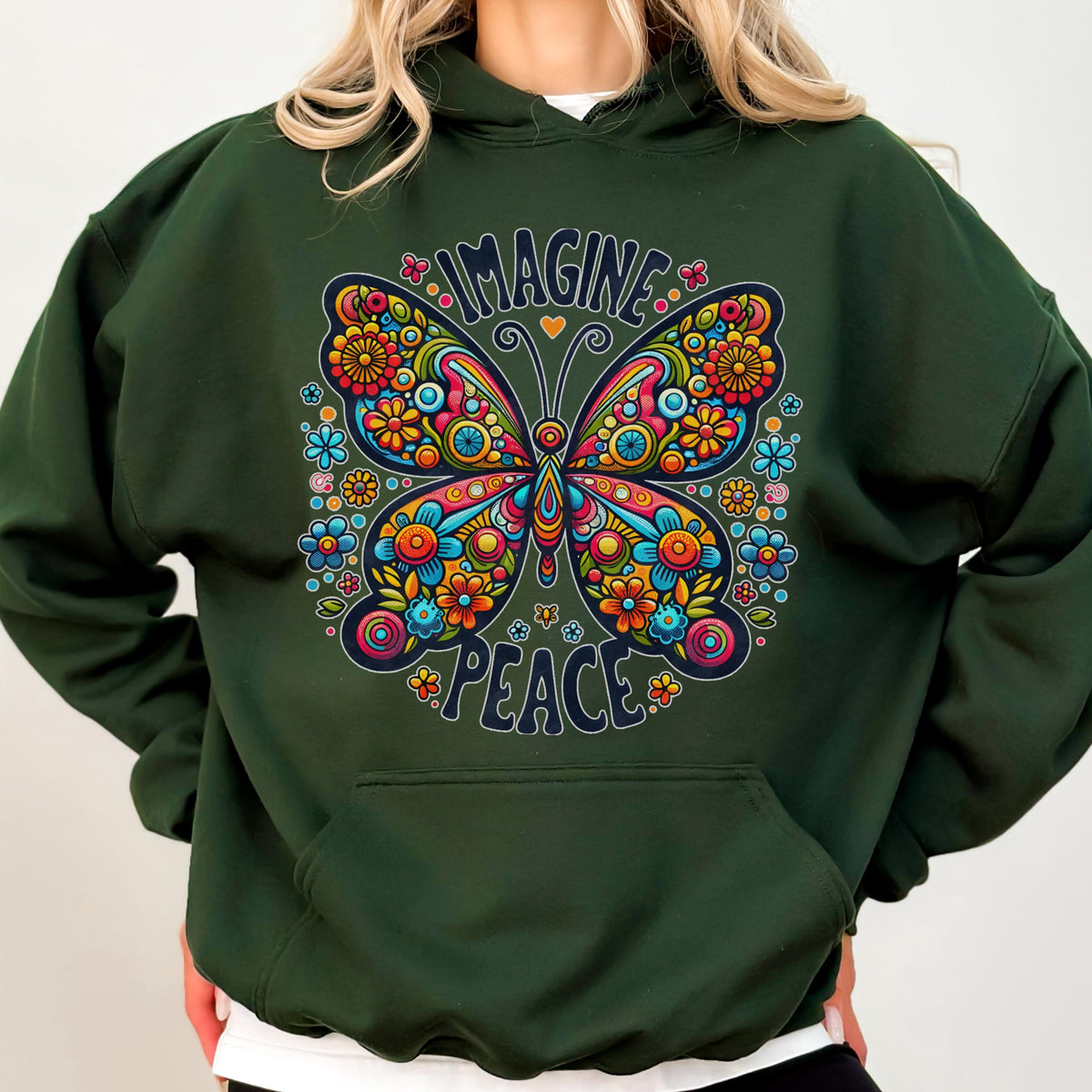 May include: Dark green hoodie with a colorful butterfly graphic. The butterfly design features intricate floral patterns in shades of orange, yellow, blue, and pink. The words "IMAGINE PEACE" are arched above and below the butterfly.