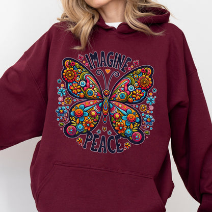 May include: Burgundy hoodie featuring a colorful butterfly design with the words "IMAGINE" and "PEACE". The butterfly is adorned with flowers in shades of orange, yellow, blue, and pink.