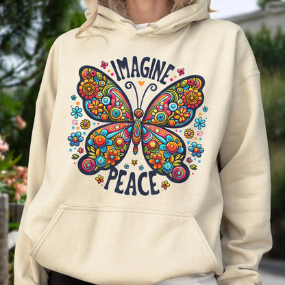 May include: Beige hoodie featuring a colorful butterfly design with the words "IMAGINE" and "PEACE". The butterfly is adorned with flowers in shades of blue, orange, yellow, and pink. The hoodie has a drawstring hood and a kangaroo pocket.