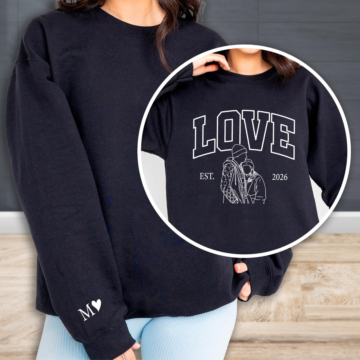 May include: Black sweatshirt with a white heart and the letter "M" on the left sleeve. A circular inset shows a close-up of the sweatshirt design, featuring the word "LOVE", the year "2026", and a couple illustration.