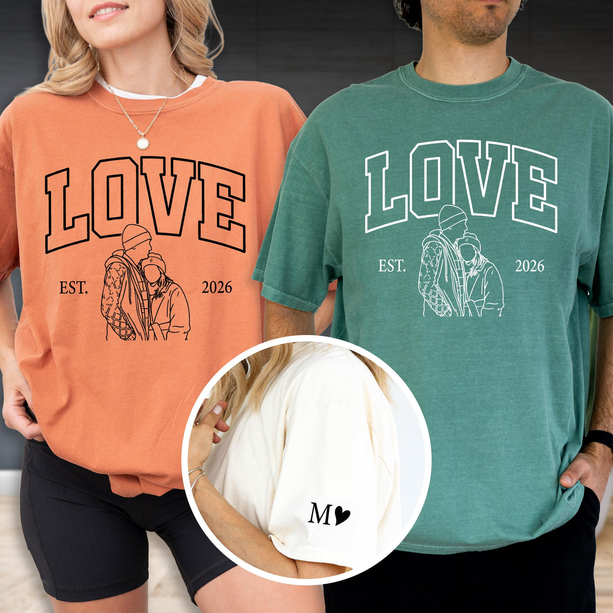 May include: Two matching t-shirts, one orange and one green, each with the word "LOVE" in bold letters. Below the word is a line drawing of two people embracing, with "EST. 2026" underneath. A third shirt is cream colored with the letter "M" and a heart.