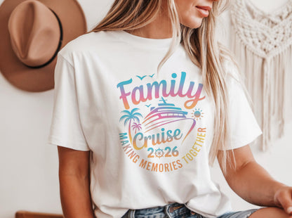 May include: White t-shirt with a colorful graphic design. The design includes the words "Family Cruise 2026" with a cruise ship, palm trees, and a sun. The text "Making Memories Together" is also included.