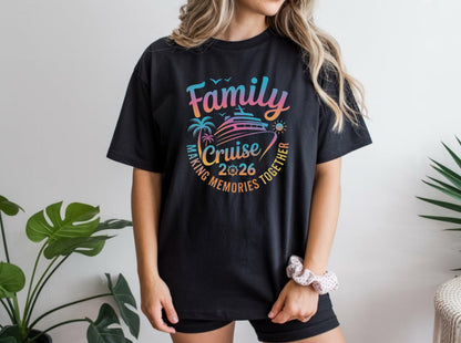 May include: Black t-shirt with a colorful graphic design. The design includes the words "Family Cruise 2026" with a cruise ship, palm trees, and the phrase "Making Memories Together."