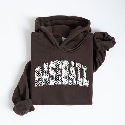 May include: A dark brown hoodie with the word "BASEBALL" in large white letters across the front. The letters are filled with a dotted pattern. The hoodie has a drawstring hood and long sleeves.