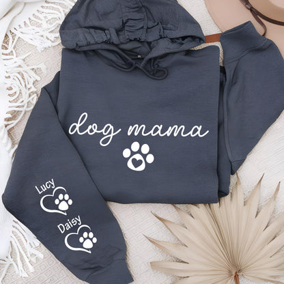 May include: Dark gray hoodie with the text "dog mama" in white script, a white paw print with a heart, and the names "Lucy" and "Daisy" with paw prints inside hearts on the sleeve. The hoodie has a drawstring hood.