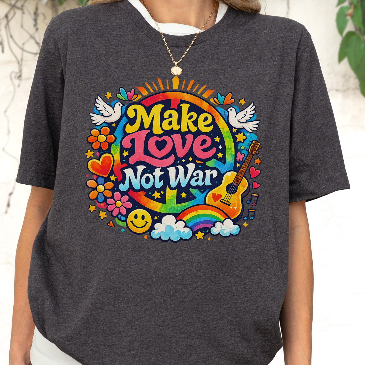 White cotton t-shirt featuring a retro colorful rainbow illustration and 'Make Love Not War' text, vintage style peace and human rights themed graphic tee