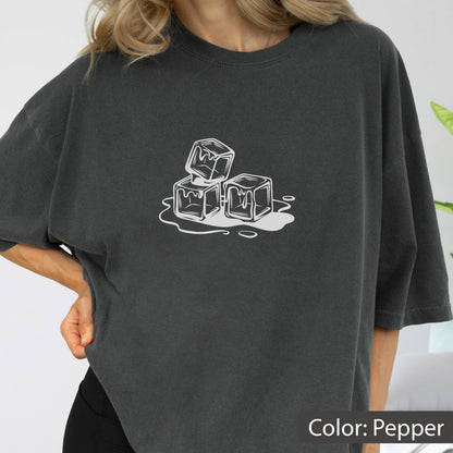 May include: Pepper-colored t-shirt featuring a white graphic of three melting ice cubes. The design is a simple, line-art style. The shirt has a relaxed fit and short sleeves.