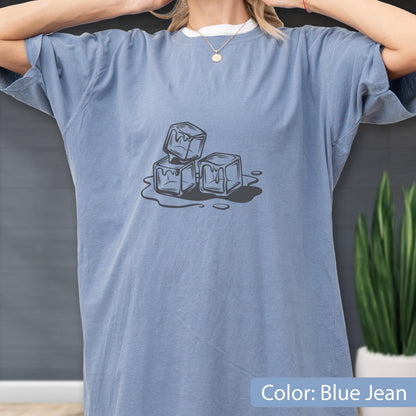 May include: Blue jean colored t-shirt with a graphic of three melting ice cubes. The shirt has short sleeves and a relaxed fit. The text "Color: Blue Jean" is at the bottom of the image.