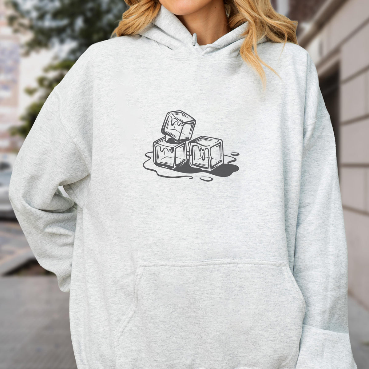 May include: Light gray hoodie with a black and white graphic of three melting ice cubes. The hoodie has a front pocket and a drawstring hood. The ice cube design is centered on the chest.