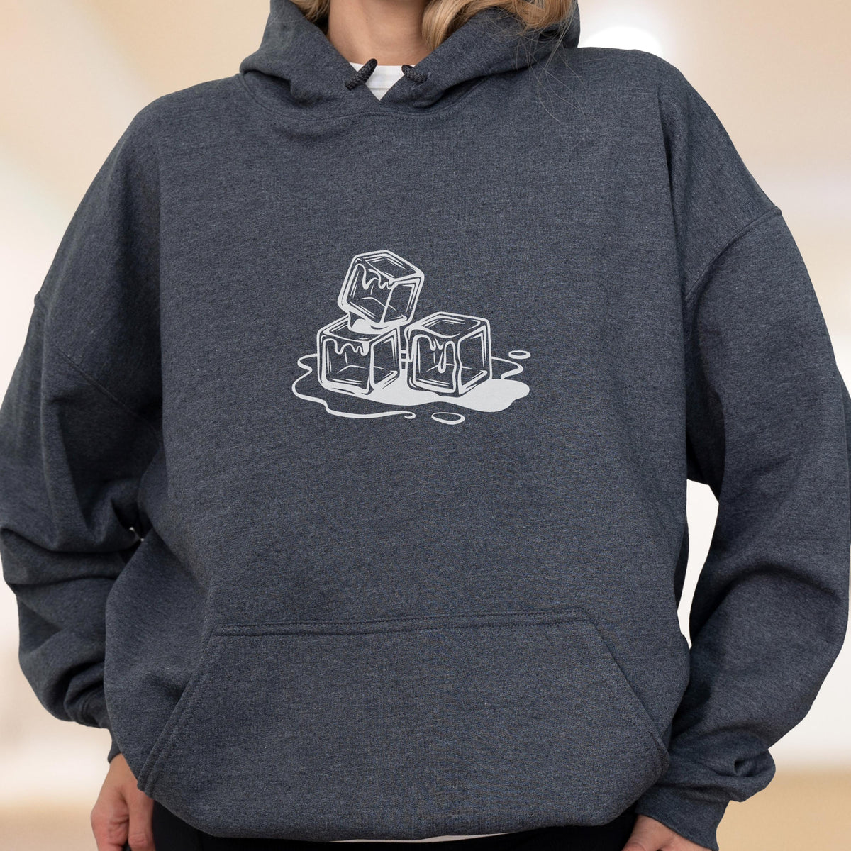 May include: Dark gray hoodie with a front pocket and a drawstring hood. The hoodie features a white graphic of three melting ice cubes. The graphic is centered on the chest.