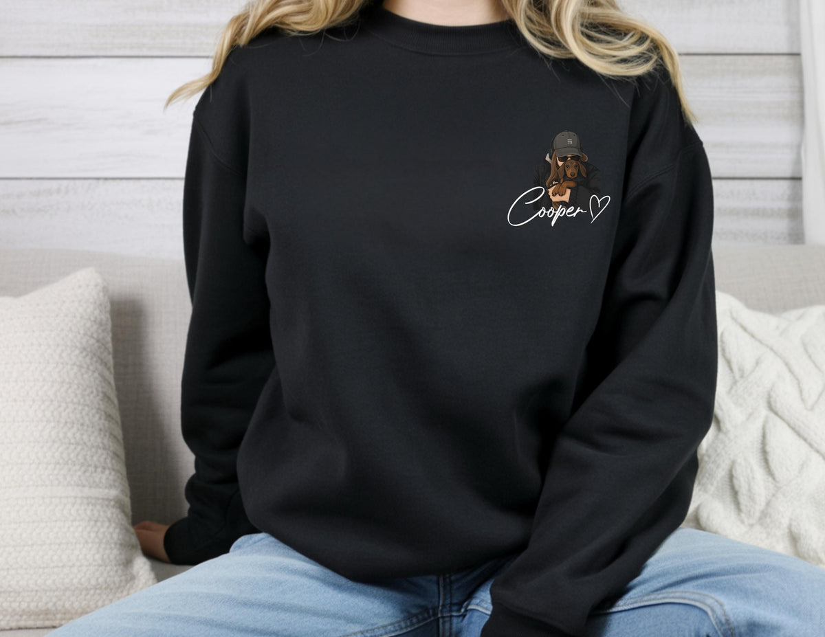 May include: Black sweatshirt featuring a graphic of a dog wearing a hat, with the name "Cooper" and a heart symbol in white script. The sweatshirt is a solid black color.