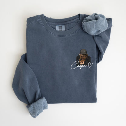May include: A blue long-sleeve sweatshirt with a custom illustration of a dog wearing a hat and sunglasses. The dog is embraced by a person. The name "Cooper" is written in cursive with a heart.