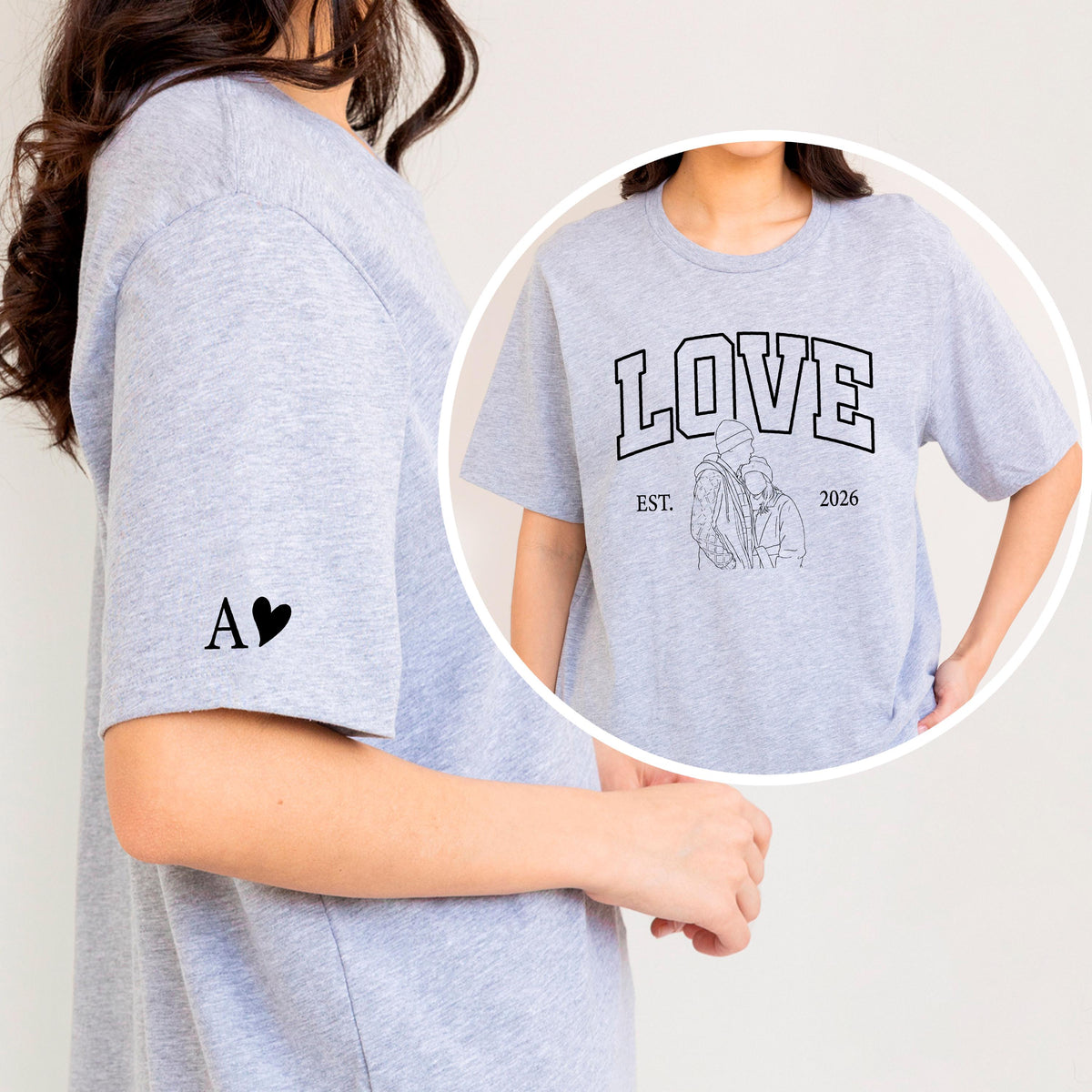 May include: A light gray t-shirt with the word "LOVE" in a collegiate font, a line drawing of a couple, and the year "2026". The left sleeve has the letter "A" and a heart. The shirt is a casual style.