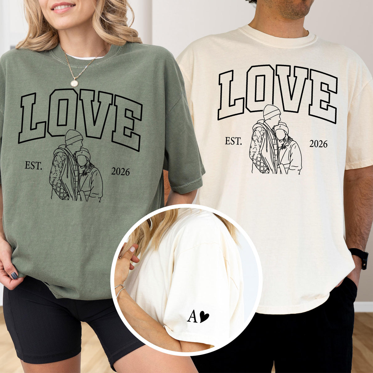 May include: Two oversized t-shirts, one sage green and one cream, featuring the word "LOVE" in bold black lettering. Below the word is a line drawing of a couple, with the text "EST. 2026". The cream shirt has a small "A" and a heart on the sleeve.