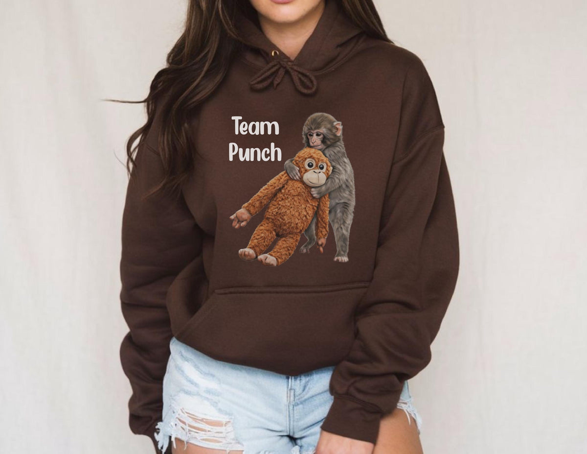 May include: A dark brown hoodie with the text "Team Punch" above a graphic of two monkeys embracing. One monkey is brown, and the other is gray. The hoodie has a drawstring and a front pocket.