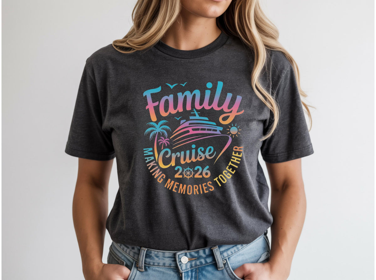 May include: Dark gray t-shirt with a colorful graphic that reads "Family Cruise 2026 Making Memories Together." The design includes a cruise ship, palm trees, and a sun. The shirt is a crew neck.