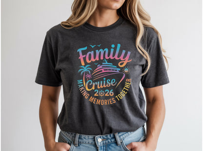 May include: Dark gray t-shirt with a colorful graphic that reads "Family Cruise 2026 Making Memories Together." The design includes a cruise ship, palm trees, and a sun. The shirt is a crew neck.