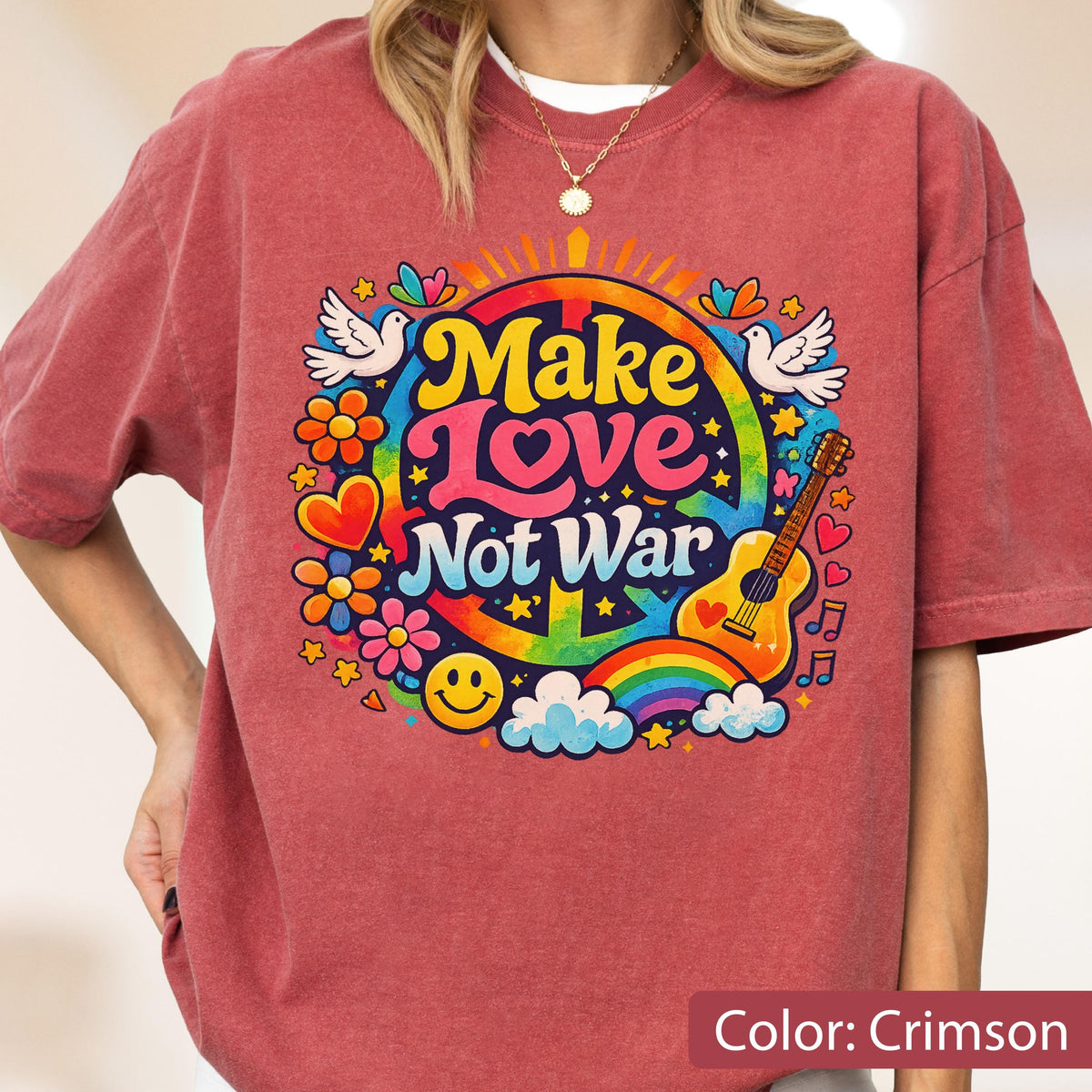 May include: Crimson-colored t-shirt with a colorful "Make Love Not War" graphic. The design includes a peace sign, rainbow, guitar, flowers, doves, and a smiley face. The shirt is a casual, short-sleeved style.