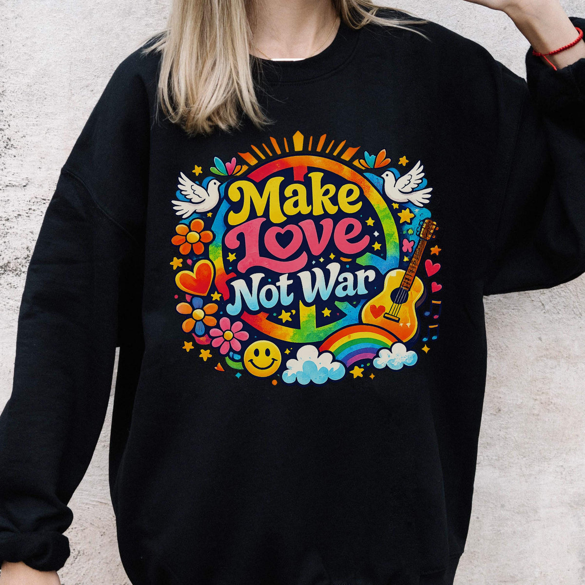 May include: Black sweatshirt with a colorful graphic that says "Make Love Not War." The design includes a peace sign, rainbow, guitar, flowers, doves, and a smiley face.