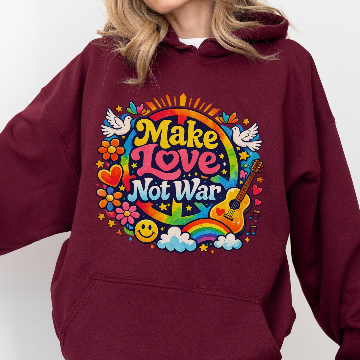 May include: Burgundy hoodie with a colorful graphic that reads "Make Love Not War." The design includes a peace sign, rainbow, guitar, flowers, doves, and a smiley face. The hoodie is a solid burgundy color.