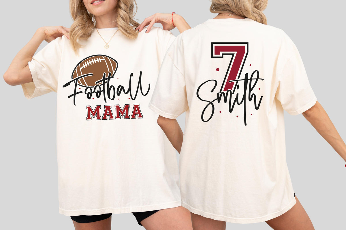 May include: An off-white short-sleeve t-shirt featuring a brown football graphic with the text Football MAMA on the front and the number 7 with the name Smith in black script on the back, both accented with maroon and black details.